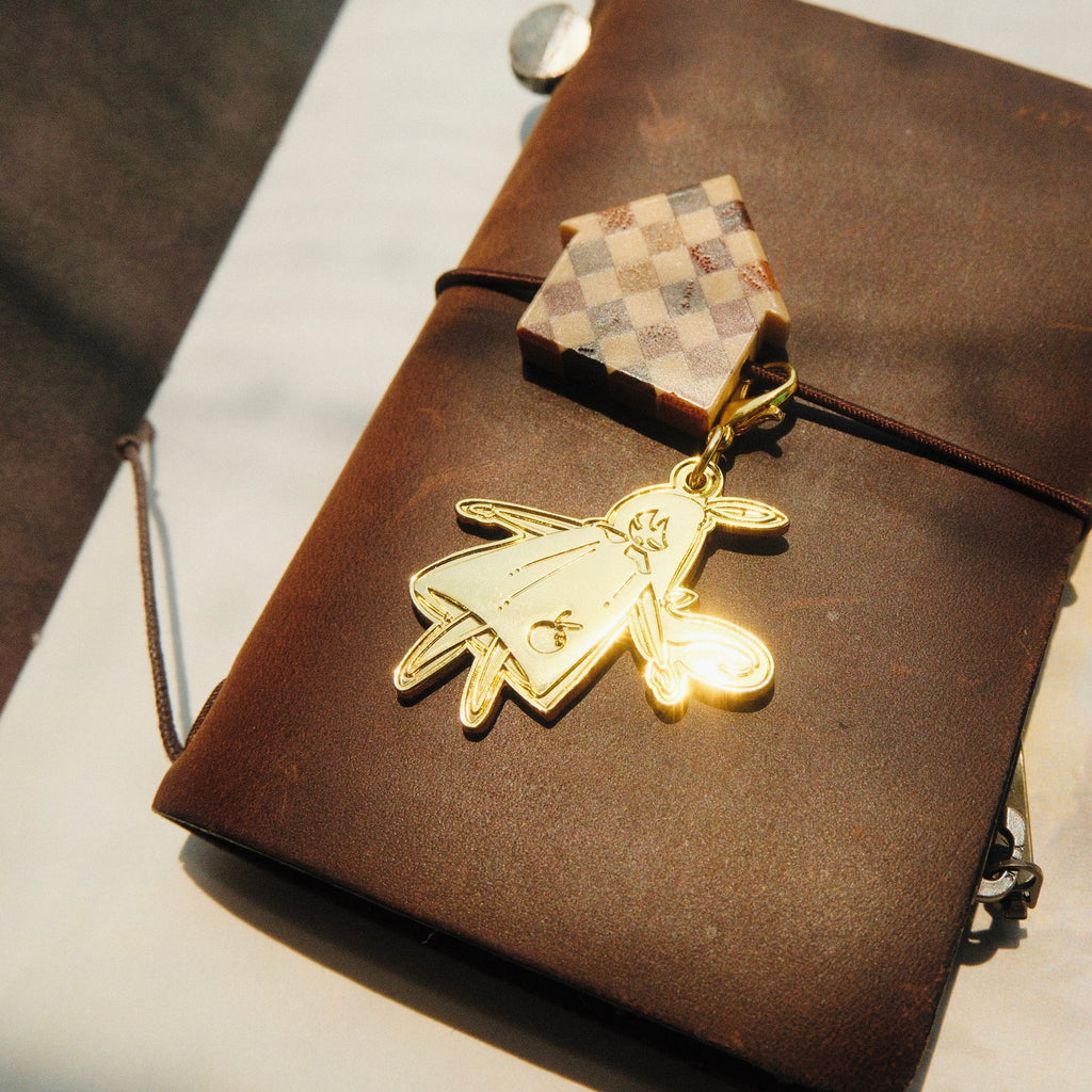 Brass Charm - Laying