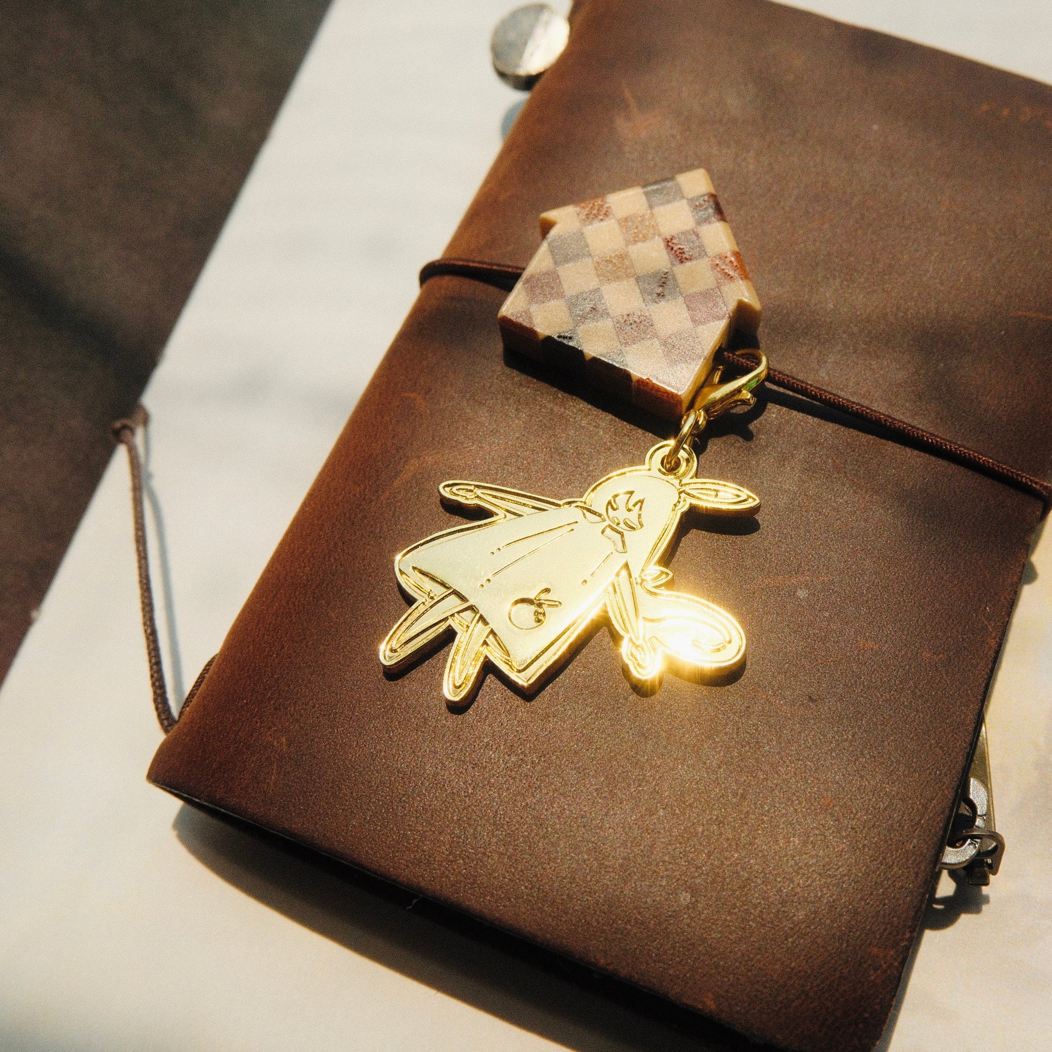 Brass Charm - Laying