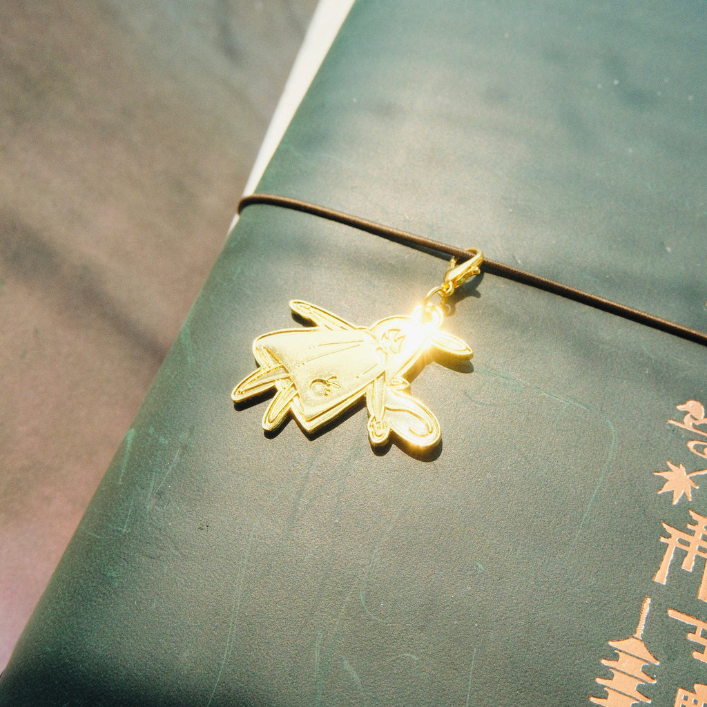 Brass Charm - Laying